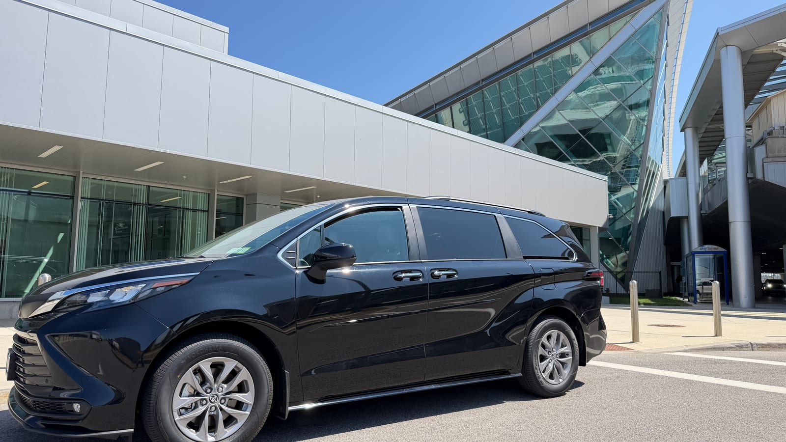 Black Toyota Sienna taxi parked at the Buffalo Niagara International Airport terminal
