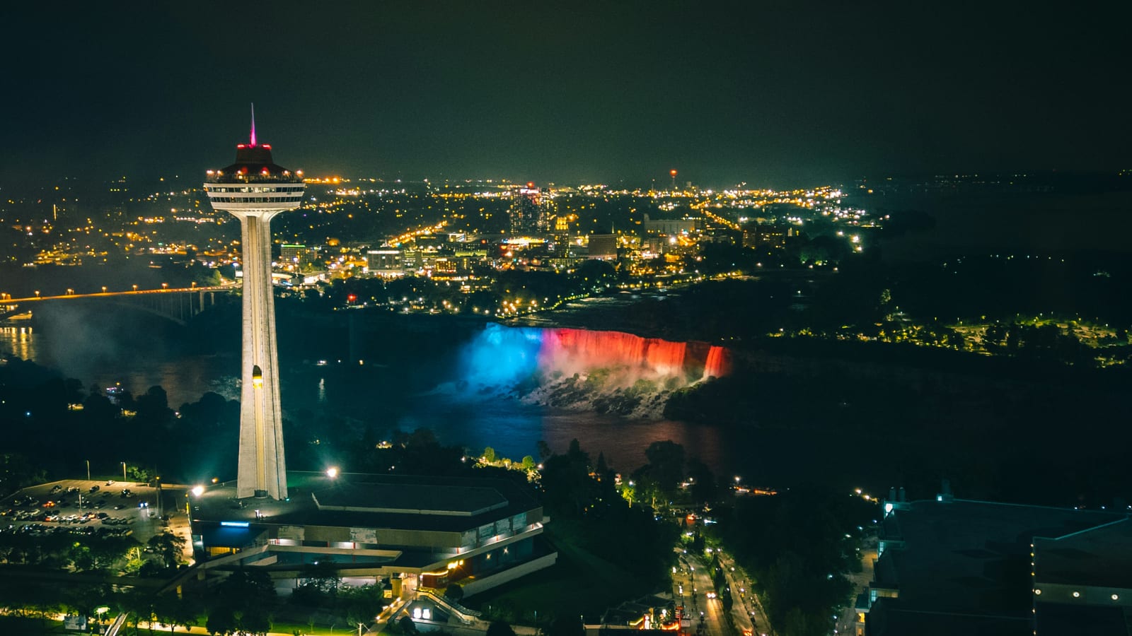 Skylon Tower and the illuminated falls at night from above